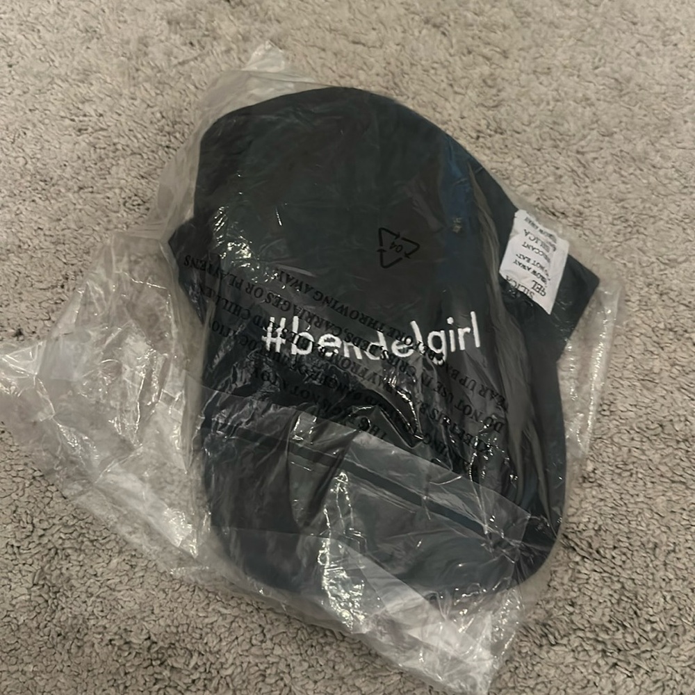 Still in plastic adjustable Henri Bendel hat